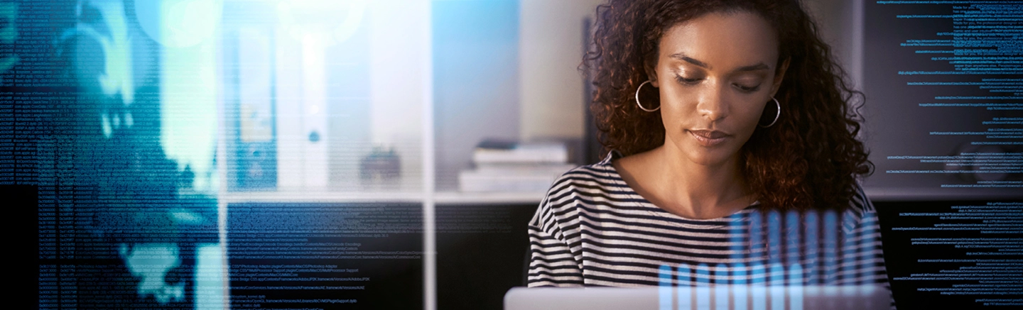 Woman sitting at a desk using a laptop