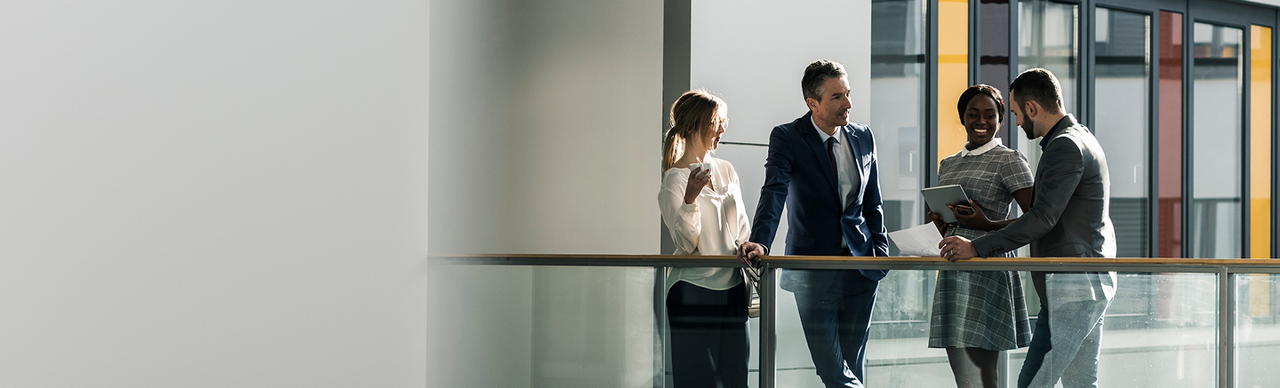 Group of people talking in an office