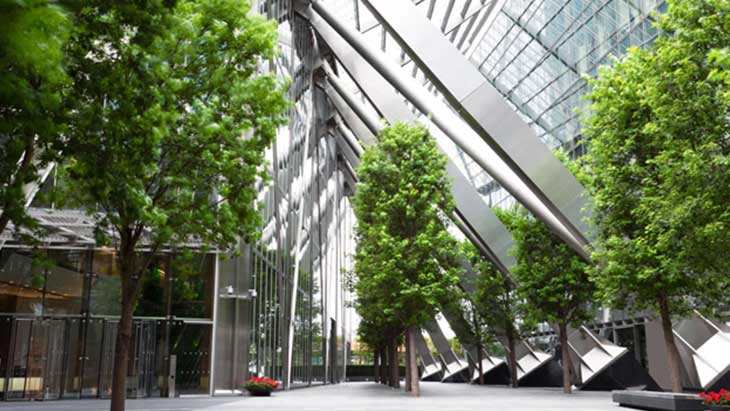 Large glass atrium with trees