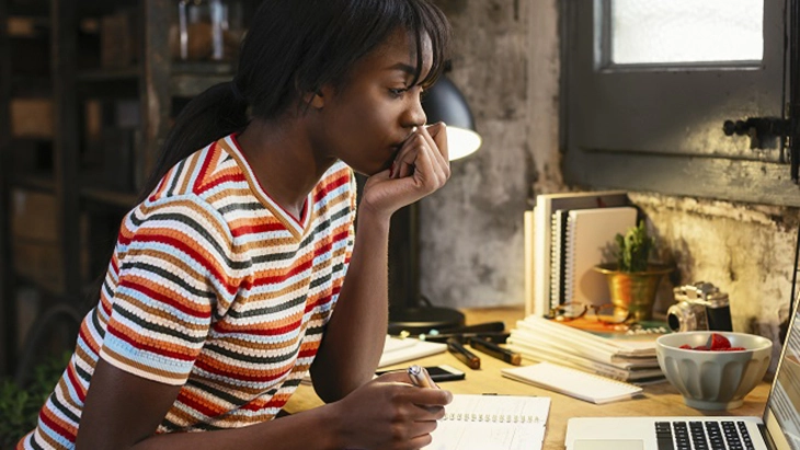 Woman in office working on laptop