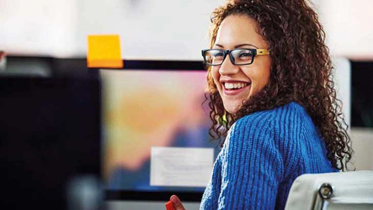 Woman laughing in office