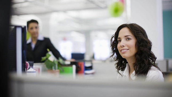 Smiling young woman in office 