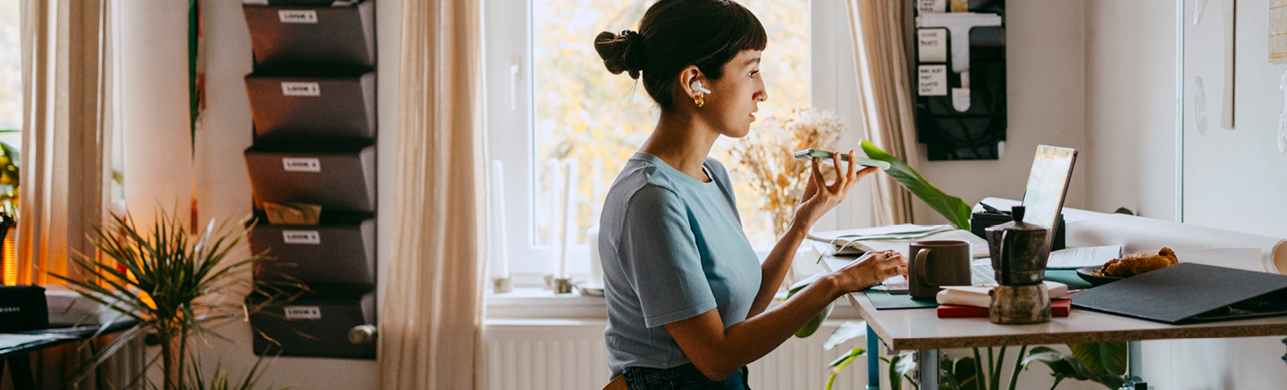 Person working at a laptop in a professional workspace, representing strategic hiring and talent planning
