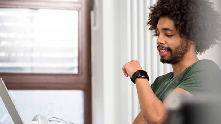 Man looking at wrist watch
