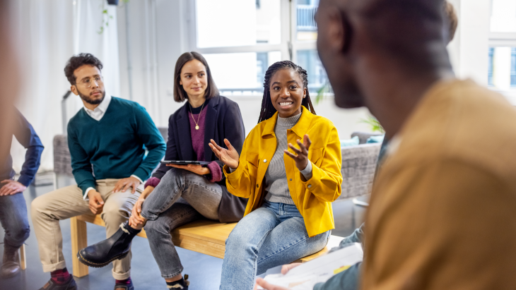 Men and women sitting together talking