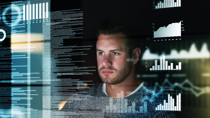 Man looking at digital screen which is displaying data