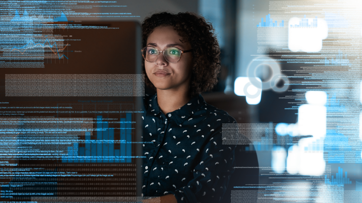 Person analysing code and data dashboards on a computer screen, illustrating artificial intelligence reshaping tech roles and the future of contractor skills.
