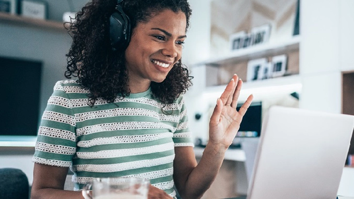 Young woman in office working with lap top