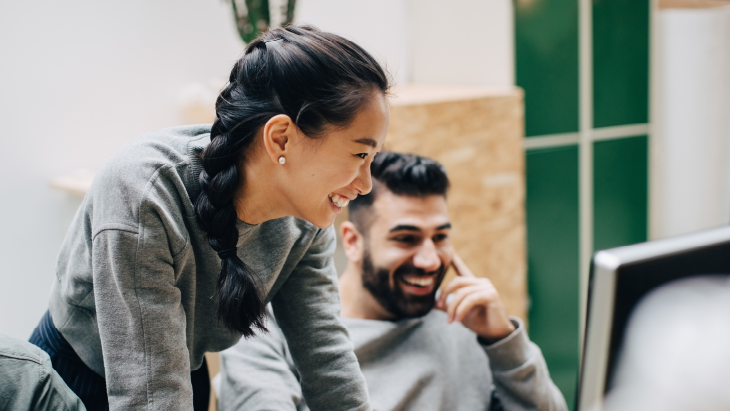 Colleagues smiling in an office