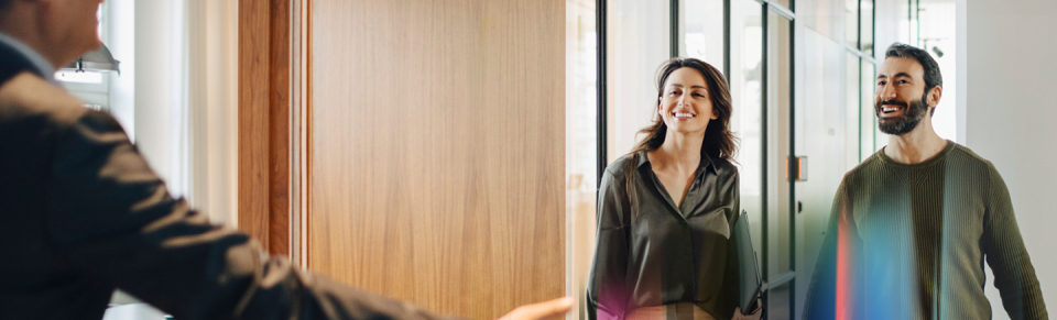 Two professionals walking through a bright modern office, representing fresh career opportunities and the theme ‘New year, new momentum’ from the Hays Career Hub.